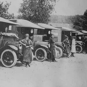 A line of Women Ambulance Drivers with their vehicles - Art Print