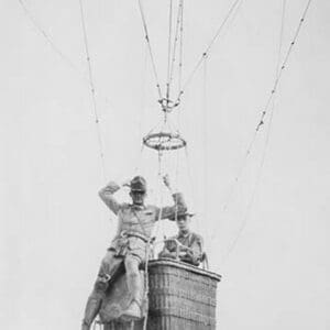 Balloon jump by a parachutist hanging from a basket suspended by it but out of the image. - Art Print