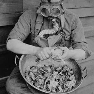 Soldier dons Gas Mask to Protect himself from Crying over Onions - Art Print