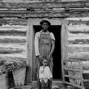 Young sharecropper and his first child by Dorothea Lange - Art Print